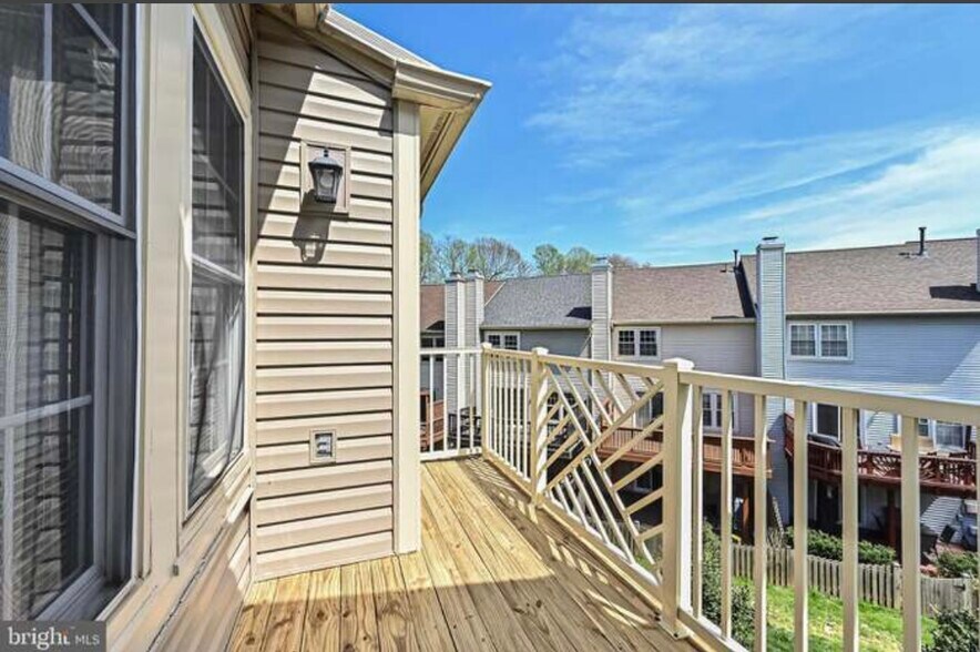 Back deck with small storage room - 12001 Ridge Knoll Dr