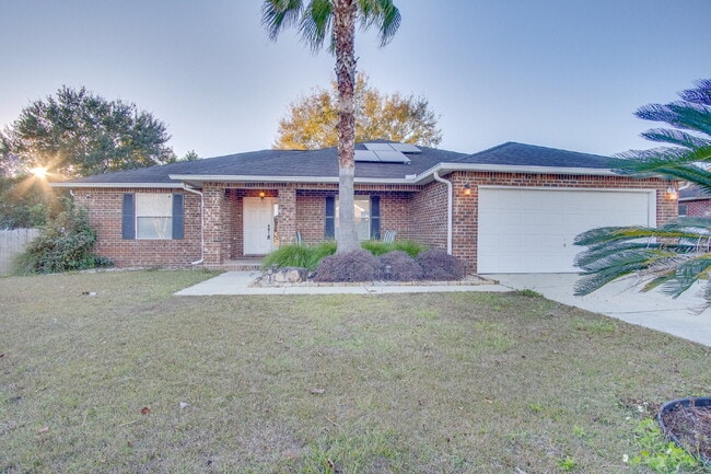 Building Photo - Energy-Efficient 3BR/2BA Solar Home in Pace with Screened Porch, Fenced Backyard, Updated Kitchen...