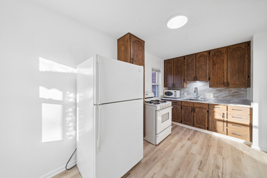 Kitchen. Appliances to be updated prior to move-in. - 16079 Forest Ave