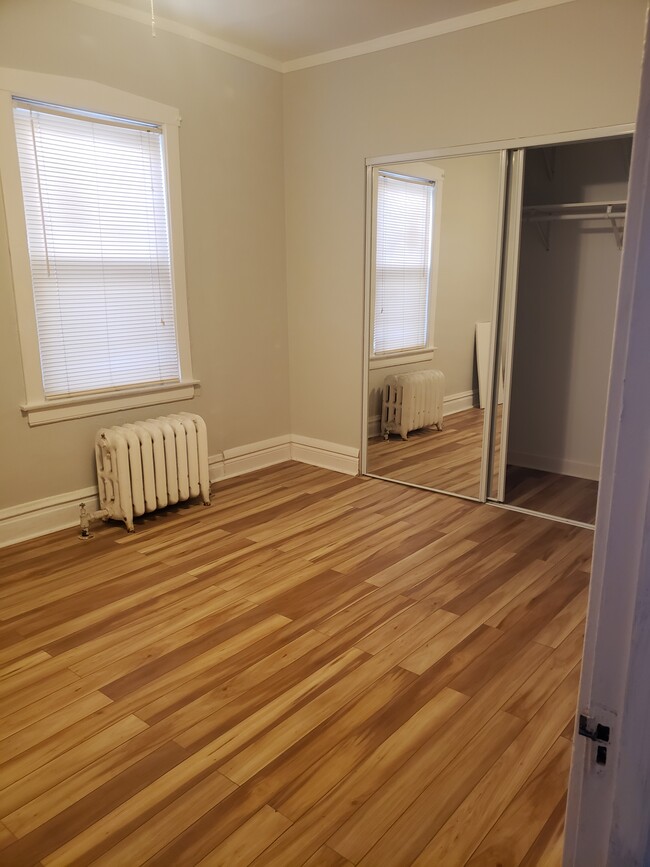 Bedroom #3 freshly painted with hardwood floors - 3811 N Central Park Ave