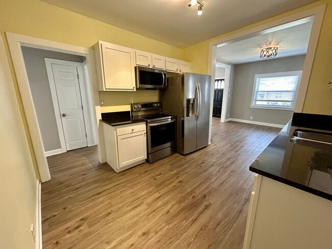 Building Photo - DELHI TWP- Spacious 4 bedroom 3 bath Cape Cod with garage