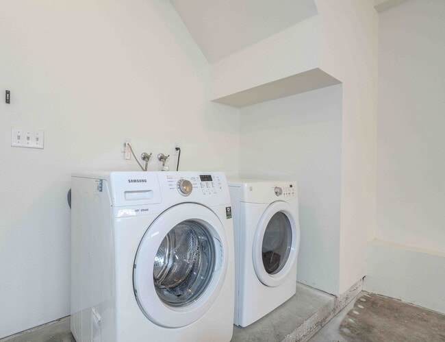 Building Photo - Gated Townhome with Updated Kitchen and Private Backyard