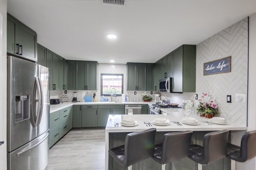 Share meals or set up a makeshift workspace in the spacious kitchen island - 5551 Churchward St