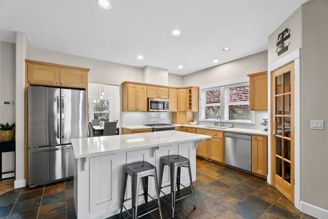 Building Photo - **Spacious 4-Bedroom Craftsman Home on Awb...