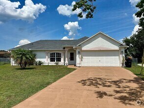 Building Photo - Three-Bedroom House with a Fenced Yard!