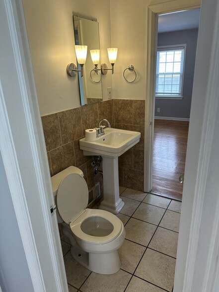 On the other side of half bath is a main floor bedroom. - 5101 Boulevard Pl