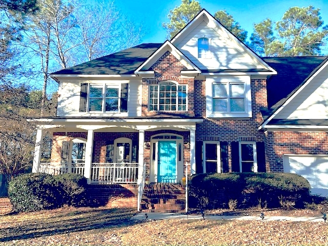 Front of home with patio and 2-car attached garage - 1977 Culpepper Ln