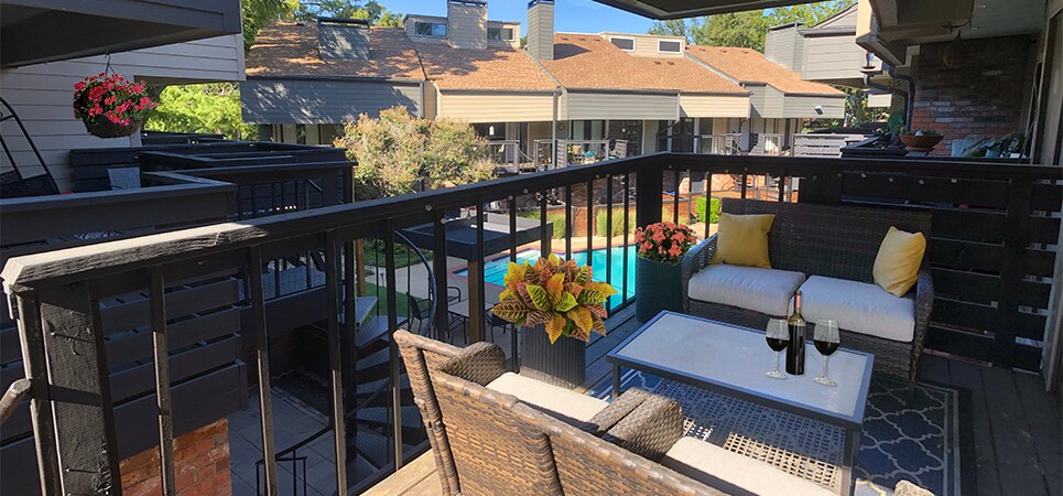 The extra large living room balcony overlooks the pool - 8710 Park Ln