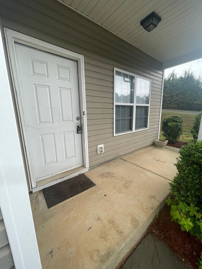 Building Photo - This two-story, 4-bedroom, 2-bath duplex in Fort Mill, SC sits on a corner lot