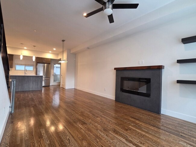 Building Photo - STUNNING 4-LEVEL TOWNHOME IN HIGHLANDS WITH SAUNA, 2-CAR GARAGE + AMAZING ROOFTOP DECK!