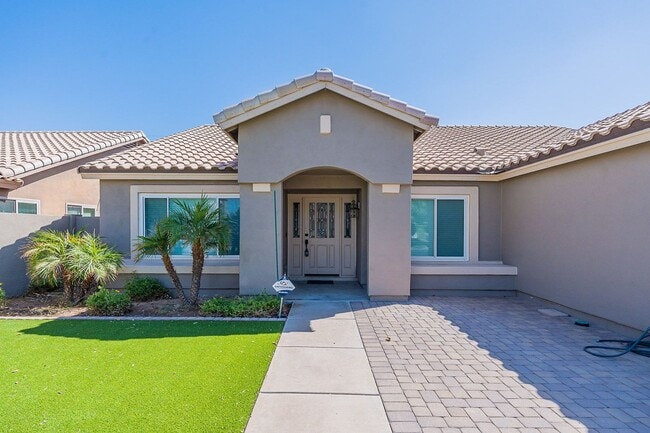 Building Photo - Charming 4-Bedroom Home with Luxurious Poo...