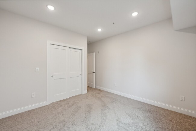 Building Photo - "NEW CONSTRUCTION 4-Bedroom Condo with Gra...