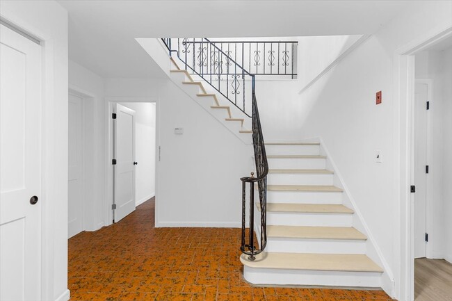 Large entry foyer with tiled flooring. Has access to the garage and laundry room. - 45 High St