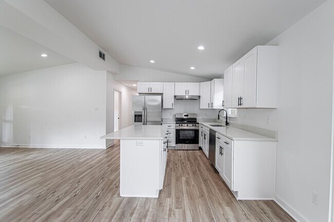 Building Photo - Large Open-Concept 4 Bedroom with Stunning Pond Views!