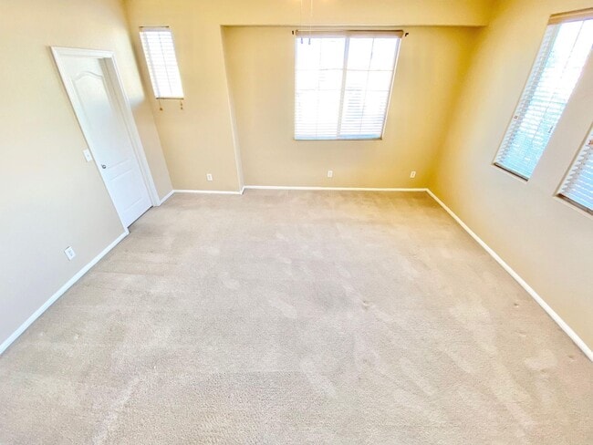 Building Photo - THIS SPACIOUS RESIDENCE FEATURES 4 BEDROOM...