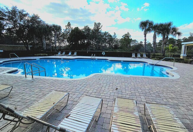 Building Photo - Avalon Park corner end Townhome featuring 3 bedrooms, 2.5 baths, plus office, and 2 car garage.