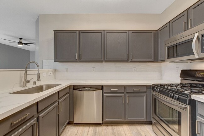 Building Photo - Upgraded First-Floor Condo in a Gated Summ...