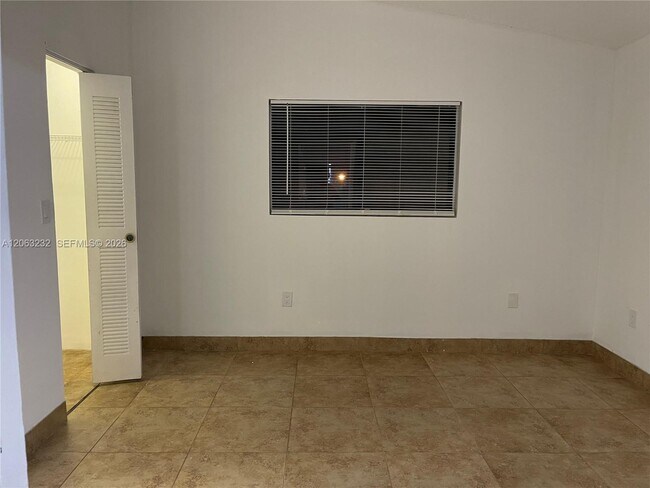 Building Photo - 9491 Palm Cir S