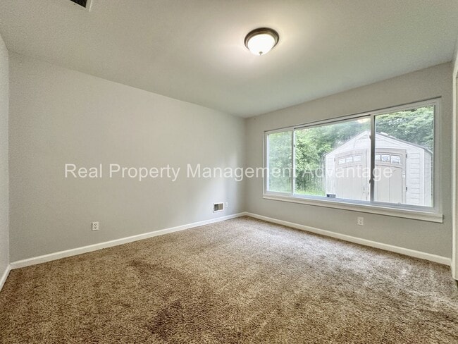 Building Photo - Mid-Century Ranch Boasts 3 Large Bedrooms ...