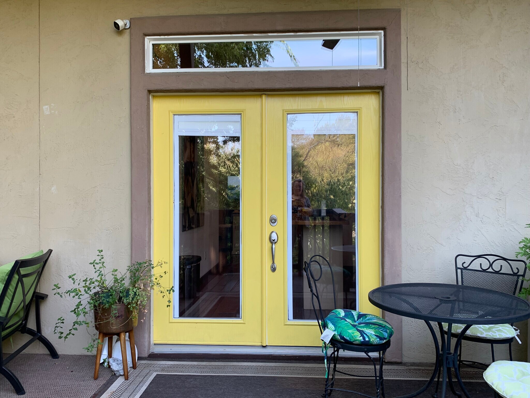 Back door leads to deck with patio furniture. Tall trees. Fenced yard. - 905 Prospect Ave