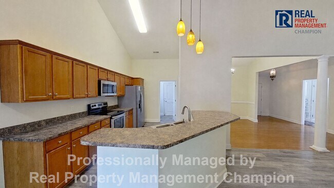 Building Photo - 3BD/2BA home w/vaulted ceilings, fireplace, 2-car garage, deck and fenced backyard