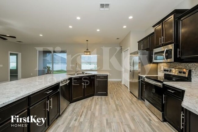 Building Photo - 5952 Valentino Way