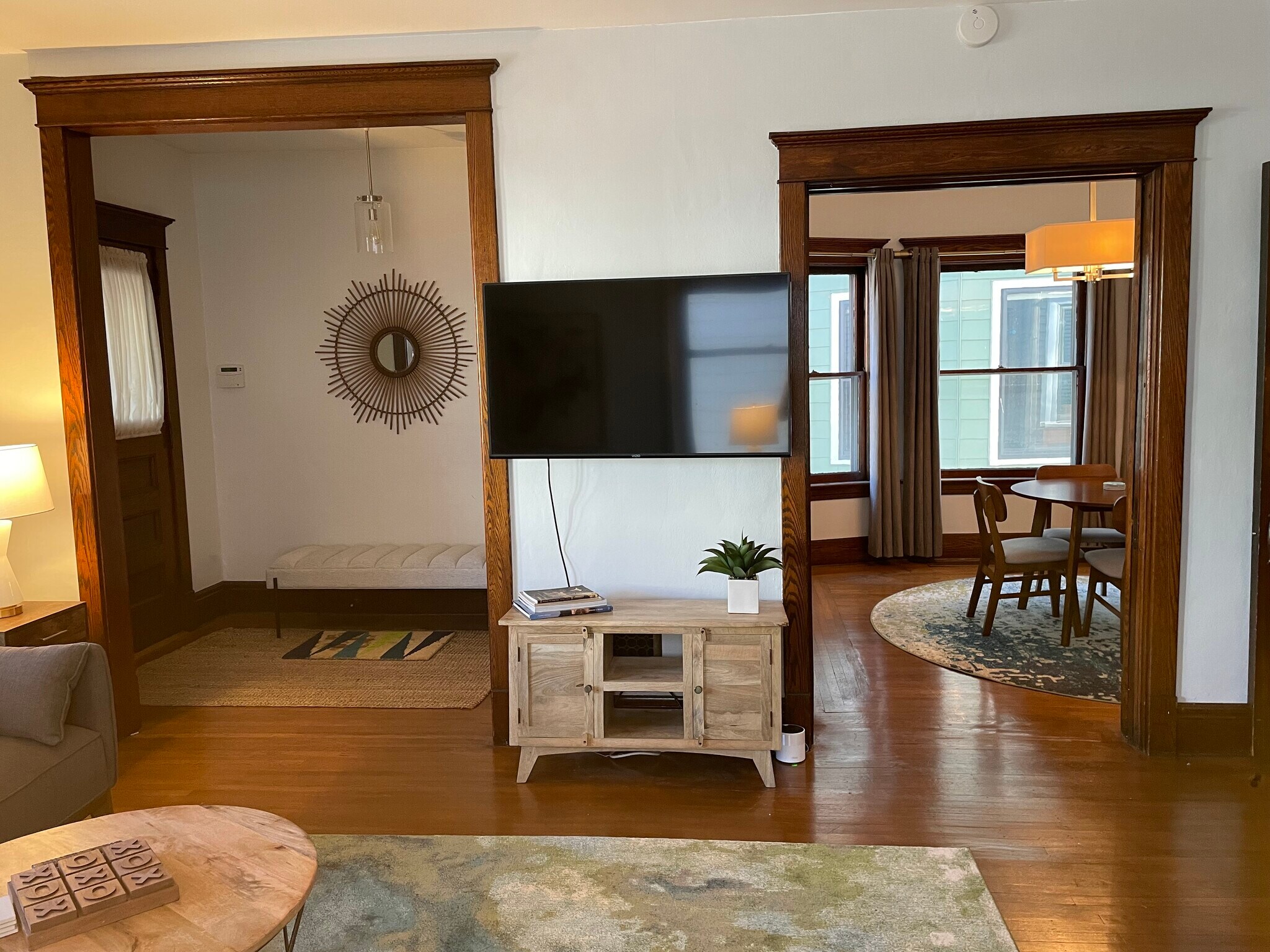 Entrance way and dining room connected to living room. 55" Smart TV. - 28 Saint James Pl