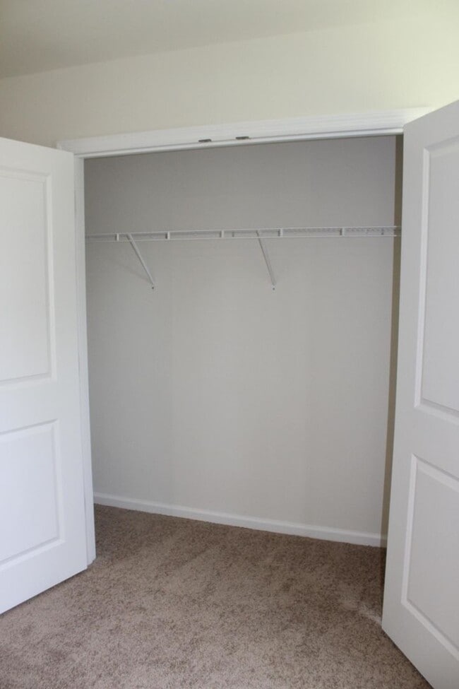 Building Photo - Sun-Filled 3-Story End-Unit Townhome with Fenced Yard, Storage & Resort-Style Pool