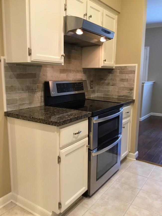 Stainless double oven and stainless vent-hood - 1103 Dulles Ave