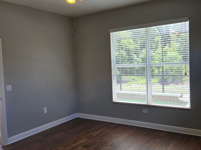 Building Photo - Freshly Painted 4BR/2BA Pool Home with Screened Pool & Spa – Move-In Ready!
