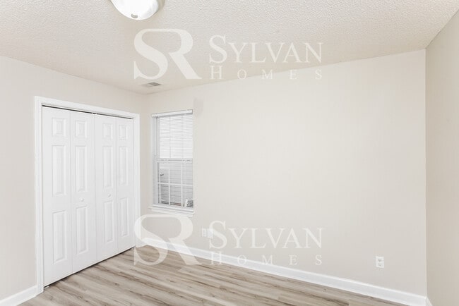Building Photo - Welcome to this beautiful and sun-filled 3...