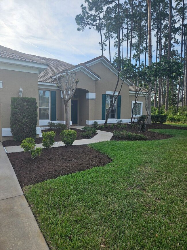 Building Photo - 4 BEDROOM 3 FULL BATH HOME WITH A SCREENED IN POOL IN THE BEAUTIFUL PALM COAST