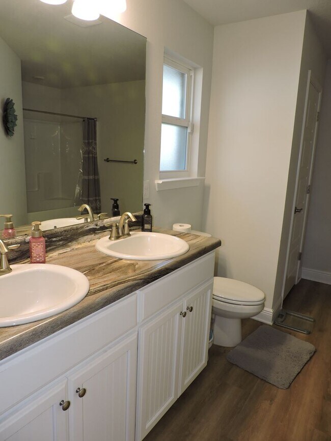 Building Photo - Almost new four bedroom home with solar pa...