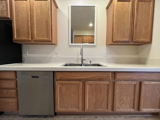 Building Photo - Inviting Two-Story 3BR Home Featuring New Carpet, New Stainless Appliances, Spacious Garage Stora...