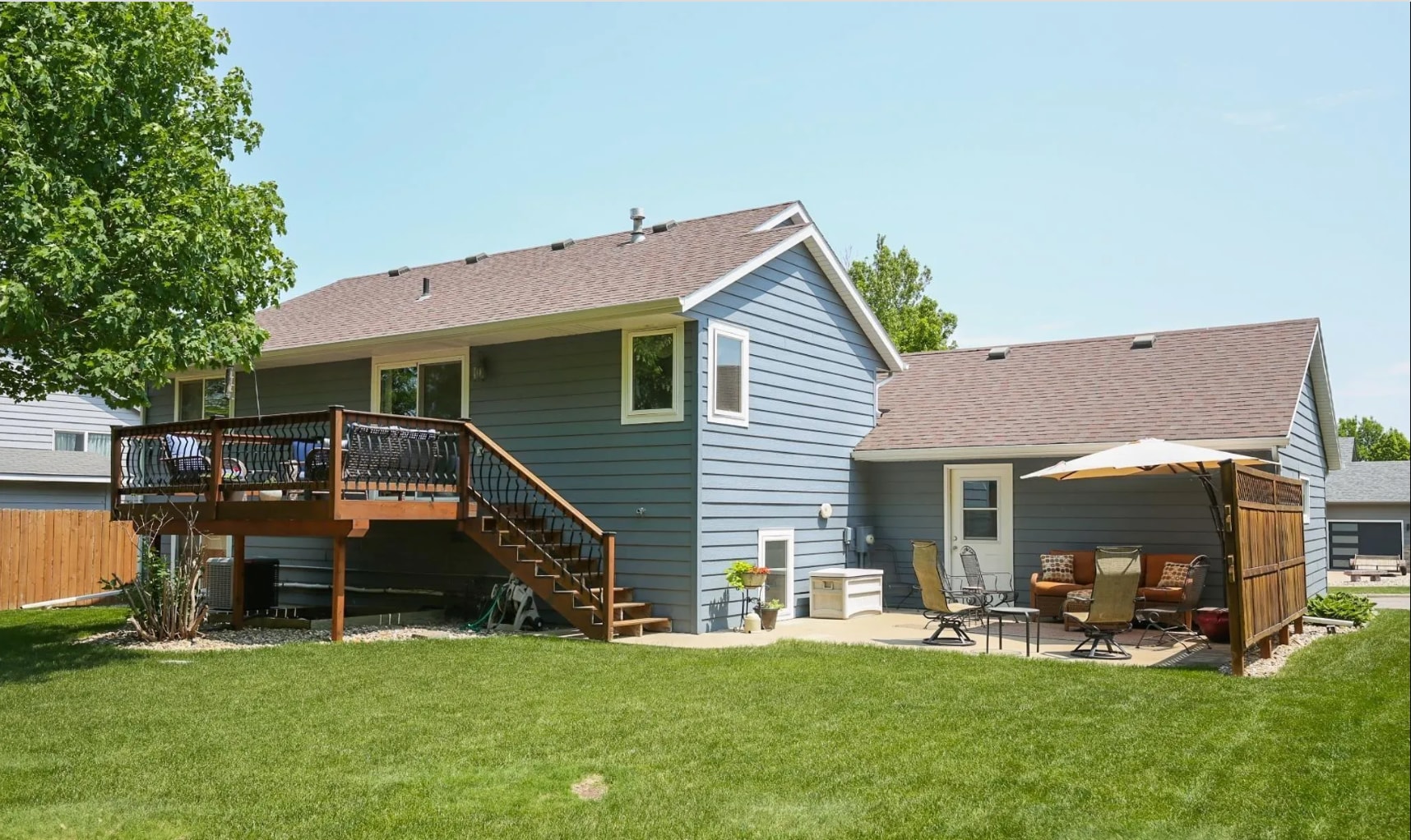 Rear of the home with deck and patio - 2005 S Gordon Dr