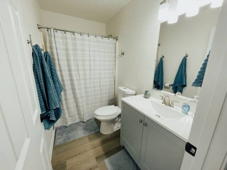 Full bath upstairs. Shower over tub. - 424 Sioux Trail