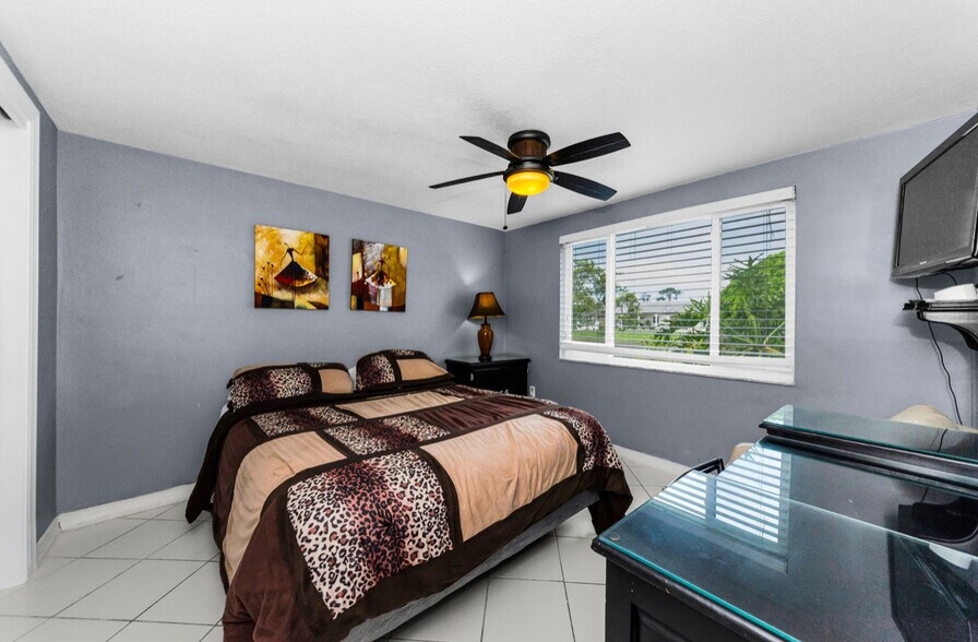 2nd bedroom (water view!) Queen size bed with canal water view. Vanity, night stand, closet and TV - 3931 Sail Dr