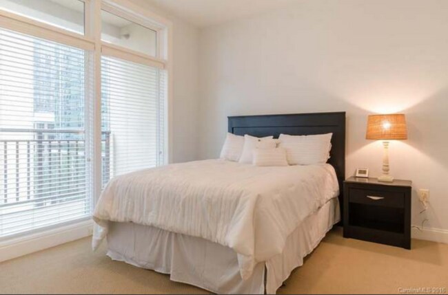 Main bedroom with balcony - 230 S Tryon St