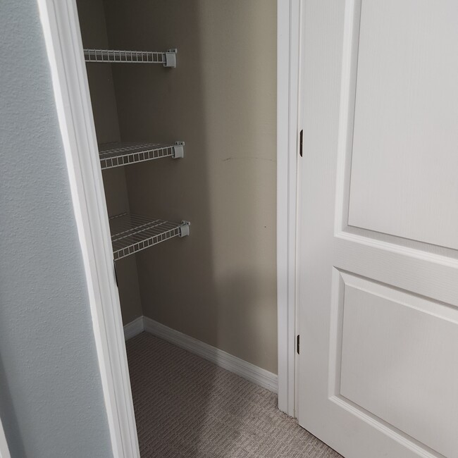 Hall linen closet - 15623 Stable Run Dr