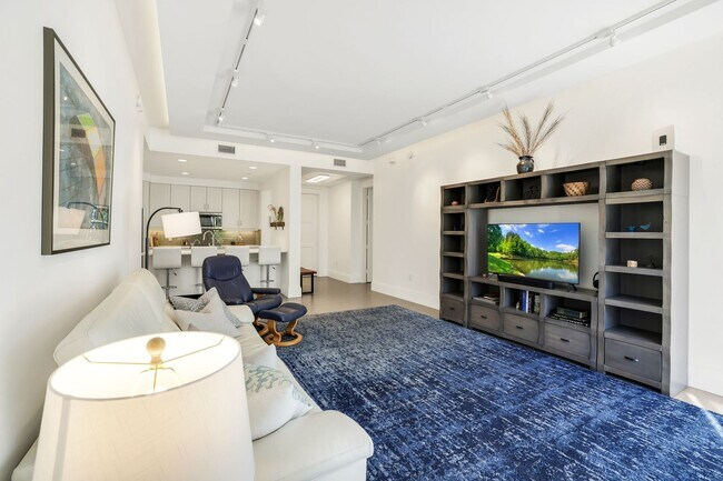 Building Photo - Luxury Living Meets Prime Location! Naples Square 2/2 Condo with Expansive Terrace