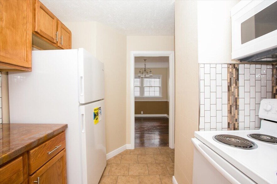 Updated kitchen with new refrigerator - 148 Niagara Ave