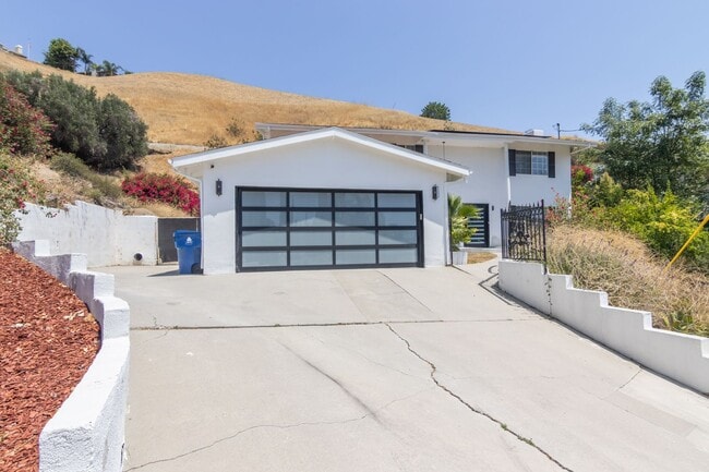 Primary Photo - 5-Bedroom, 3-Bathroom Home with Solar Pane...