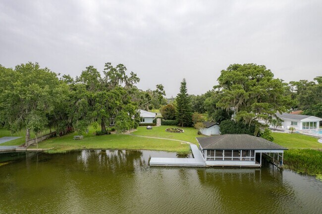 Building Photo - Lake Jessamine Luxury: Solar-Powered Waterfront Retreat on 1.14 Acres with Dock & Boathouse