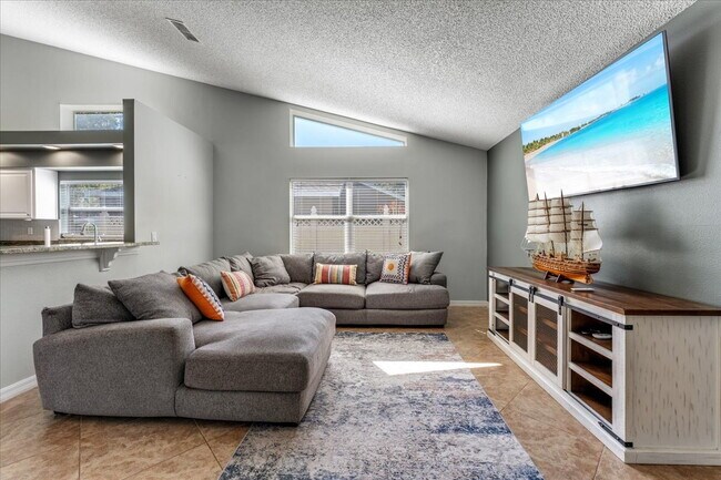 Building Photo - A vibrant 2-bedroom, 2-bathroom tropical retreat designed for both high-energy entertaining and l...