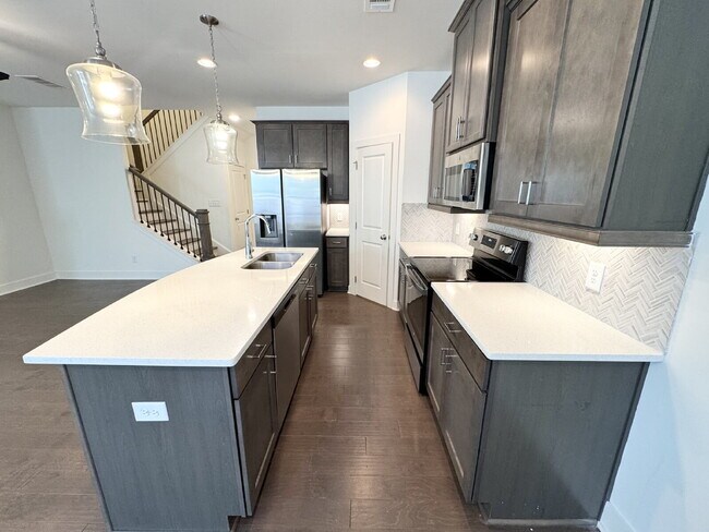 Building Photo - Stylish 3BR Townhome with Private Yard & T...