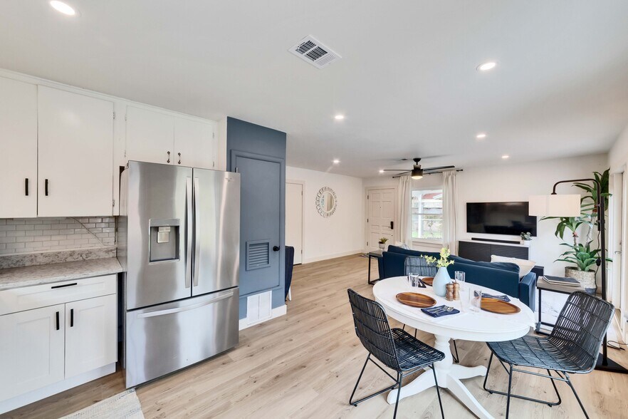 View from the kitchen, looking back to the main room, with the front door in the background - 2102 Bristol Dr