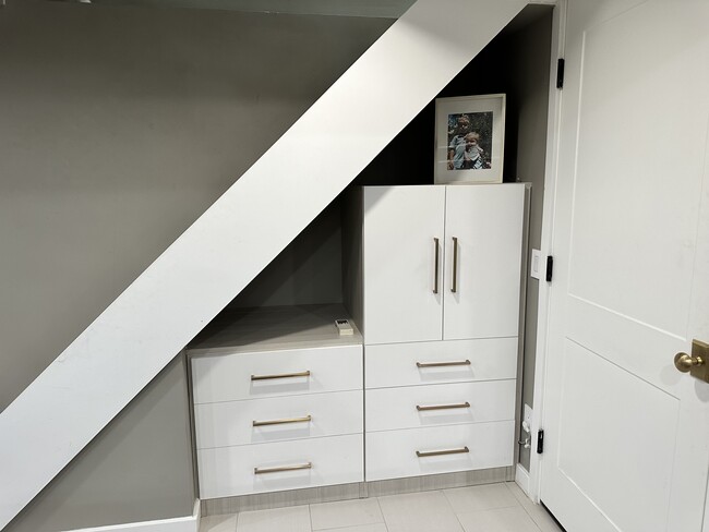 Great drawer space for clothing and shelves slide out for easy access. - 187 68th St