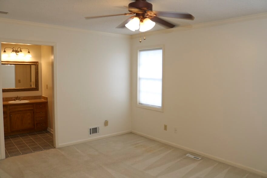Bedroom 1 overlooking the back yard. - 7005 Sand Wedge Cir