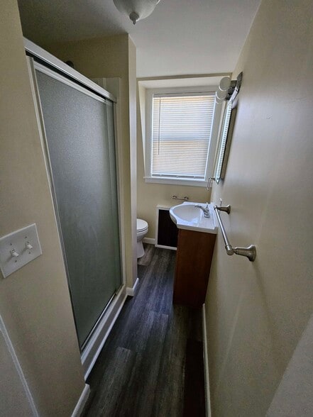 Hallway bathroom across from closet - 19 Negus St