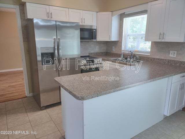 Building Photo - 7819 Lisa Dr E